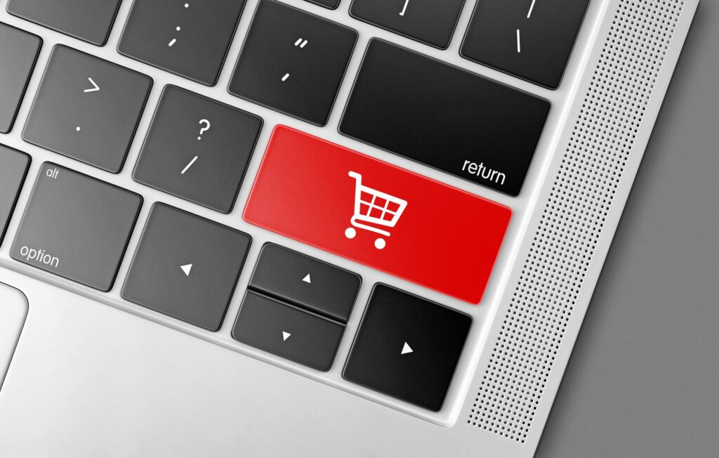 Red shopping cart key on a black computer keyboard, internet shopping concept picture